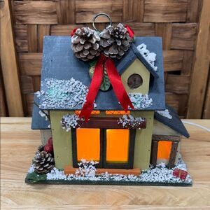 Festive Christmas Village Holiday House with Pinecones and Red Ribbon